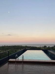 Swimmingpoolen hos eller tæt på Monoambiente Edificio DOMUS Full GYM Piscina Infinita Laundry Seguridad24hs + 17 billeder