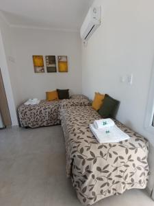 two beds in a small room with at Agua de Vida- Parque Termal Chajarí in Chajarí +39 photos