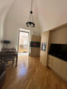 a living room with a table and a dining room at Casa Leoci in Lecce