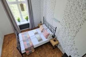 Posteľ alebo postele v izbe v ubytovaní Urban Nest Apartments Dietla 69-8B
