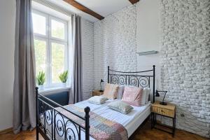 Posteľ alebo postele v izbe v ubytovaní Urban Nest Apartments Dietla 69-8B
