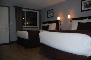 Postel nebo postele na pokoji v ubytování Rest Inn