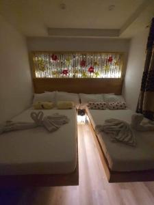 Postel nebo postele na pokoji v ubytování Baguio Breeze Encore Studio Condo