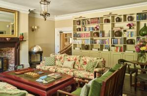 a living room with a couch and a table at The Maltings in Weybourne
