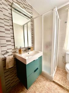 a bathroom with a sink and a shower at Blue Home in Los Alcázares +30 photos