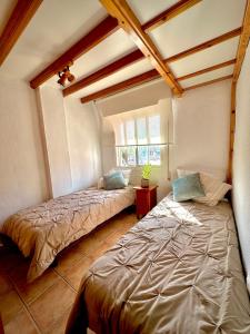 a bedroom with two beds in a room at Blue Home in Los Alcázares