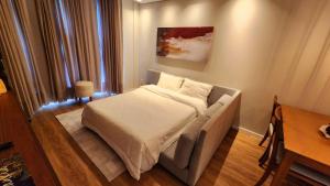 Postel nebo postele na pokoji v ubytování Sensacionale Flat no Serra Class + 35 fotografií