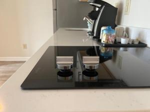 a coffee maker on a counter in a kitchen at Summer Sands - 308 by Sea Scape Properties in Wrightsville Beach