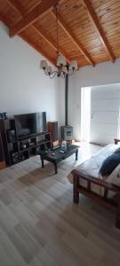 a living room with a pool table and a tv at El descanso in Ramallo +25 photos