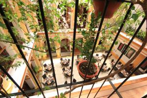an overhead view of a lobby with potted plants at Hotel Ciudad Real Centro Historico in San Cristóbal de Las Casas