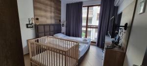 Postel nebo postele na pokoji v ubytování Luxury Apartments in Cascadas Family Resort Sunny Beach + 37 fotografií