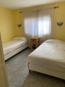 Postel nebo postele na pokoji v ubytování Aguilar House Hostel B&B