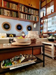 a living room with a couch and a table with food at Bohemian Retro Room Varna in Varna City