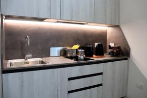 a kitchen with a sink and a counter top at La Suite di Maddalena e Andrea in Oppeano
