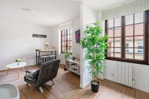 O zonă de relaxare la Grand logement 38m2, Aéroport Paris CDG, Disneyland Paris 20min, Parc Astérix, 1 Chambre, 1 Salon +47 fotografii