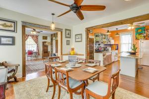 a dining room and living room with a table and chairs at about 3 Mi to Dtwn Centrally Located Birmingham Home! in Birmingham