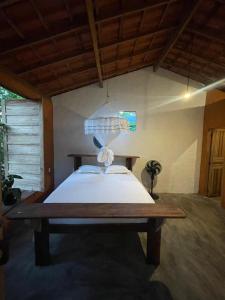 Postel nebo postele na pokoji v ubytování Quarto próximo à praia de Moreré
