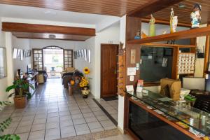 a view of a living room with a lobby at Pousada Girassol in Rio das Ostras