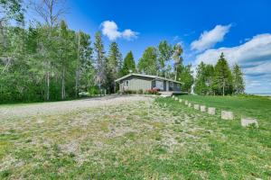 een groot veld voor een huis bij Serene Lake Huron Gem with Fishing Dock! in De Tour Village