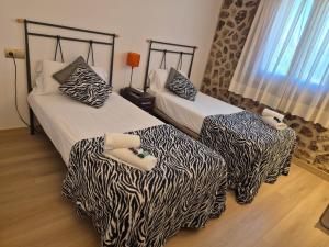 Postel nebo postele na pokoji v ubytování Hostal Bavieca