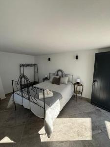 a bedroom with a large bed in a room at Quinta por do sol in Quelfes +16 photos