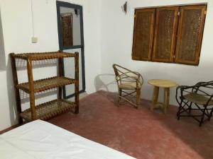 Ένα ή περισσότερα κρεβάτια σε δωμάτιο στο Barefeet Bungalow