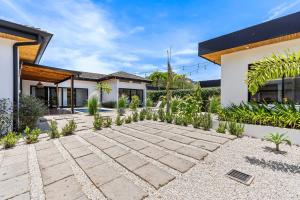 a house with a stone pathway in front of it at CU19 New 3 Bdrm Mod Home with Casita Prv Pool in Villarreal