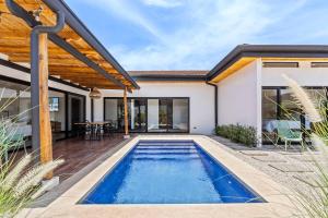 a swimming pool in the backyard of a house at CU19 New 3 Bdrm Mod Home with Casita Prv Pool in Villarreal