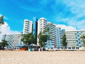 a large building on the beach next to a beach at Af Homes in Tangga Batu