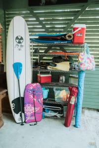 a pair of surfboards and luggage in a garage at Kona Ironman Family Home, Secluded Paradise in Kailua-Kona