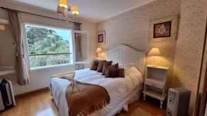 Giường trong phòng chung tại Pousada Atalaia Premium