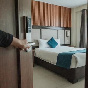 Postel nebo postele na pokoji v ubytování Hotel D'Carlo Class