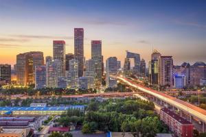 a city skyline at night with a freeway at Beijing New World Center Tongpai Hotel in Beijing