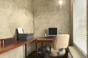 an office with a desk with a computer and a chair at Days Inn by Wyndham Brunswick/St. Simons Area in Glynn Heights