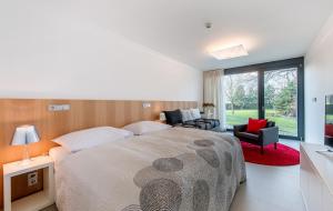 Voodi või voodid majutusasutuse Yard Resort toas