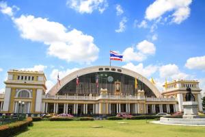 a building with a flag on top of it at OYO 225 Premier Place Bangkok in Bangkok