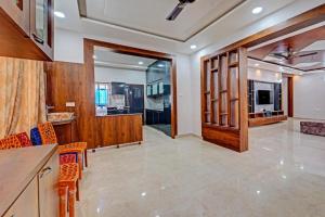 a large room with a kitchen and a living room at Vaga Suites in Tirupati