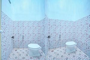 Bilik mandi di Hotel O Mutiara Homestay Syariah Near TPA / TPSA Nurul Yakin +19 gambar