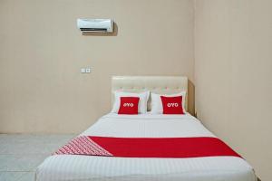 Katil atau katil-katil dalam bilik di Hotel O Mutiara Homestay Syariah Near TPA / TPSA Nurul Yakin