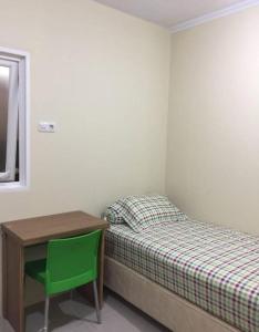 Ένα ή περισσότερα κρεβάτια σε δωμάτιο στο OYO Life 92779 Kost Arjuna +51 φωτογραφίες