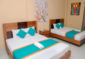 Postel nebo postele na pokoji v ubytování Dante Guesthouse