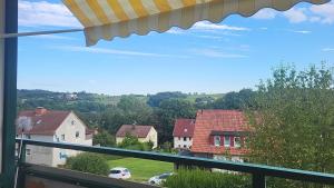 a view of a residential neighborhood from a window of a house at FeWo Talblick 22 in Bad Lauterberg +5 photos