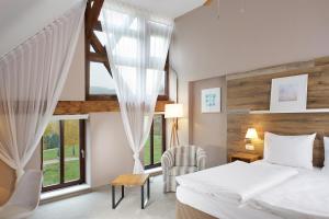 Postel nebo postele na pokoji v ubytování Cihelny Golf & Wellness Resort + 37 fotografií