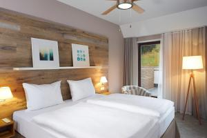 Posteľ alebo postele v izbe v ubytovaní Cihelny Golf & Wellness Resort