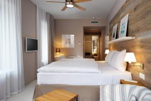 Posteľ alebo postele v izbe v ubytovaní Cihelny Golf & Wellness Resort