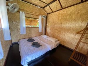 Postel nebo postele na pokoji v ubytování ทุ่งพาฝัน