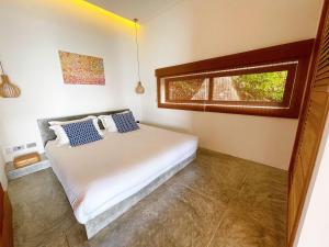Ένα ή περισσότερα κρεβάτια σε δωμάτιο στο Bella & Palma Villas +21 φωτογραφίες