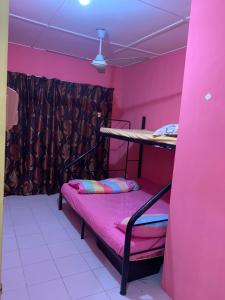 Katil atau katil-katil dalam bilik di ARIDAWA Homestay