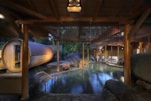 a swimming pool in a building with a house at Bankokuya in Tsuruoka +31 photos