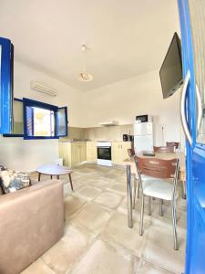 a living room with a couch and a table at Emborios Views - Holiday House in Kalymnos +19 photos